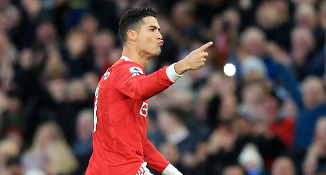 Manchester United's Portuguese striker Cristiano Ronaldo celebrates after scoring the opening goal during the English Premier League football match between Manchester United and Tottenham Hotspur at Old Trafford in Manchester, north west England, on March 12, 2022. Lindsey Parnaby / AFP